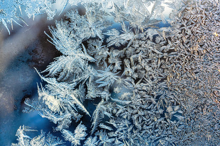 Frost texture on frozen glass in winter. Winter background.