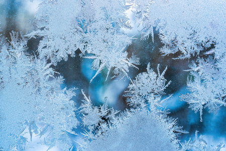 Frost texture on frozen glass in winter. Winter background.の写真素材