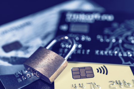 Russia, Kaluga - JULY 11, 2022: Debit or credit plastic card with lock. The concept of security, protection or blocking of funds on the card.の写真素材