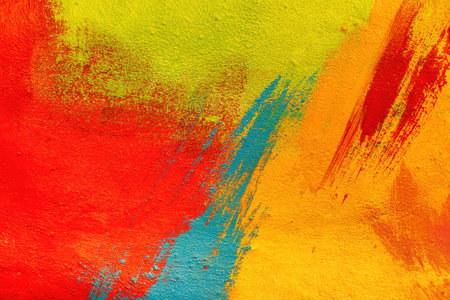A fragment of colorful graffiti painted on a wall. Abstract urban background for design. spray painting art.の写真素材