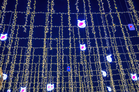 Uzbekistan, Tashkent - DECEMBER 20, 2022: Festive hanging LED garlands against the background of the...