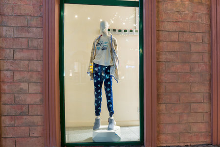 UZBEKISTAN, TASHKENT - 20 DECEMBER 2023: Exterior of clothing store with women's clothing on mannequin displaying In showcase.のeditorial素材