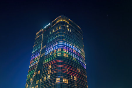 Uzbekistan, Tashkent - December 27, 2022: Hilton hotel building in night illumination on a sky background.のeditorial素材