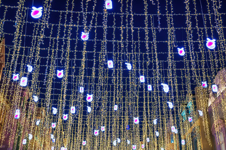 Uzbekistan, Tashkent - DECEMBER 20, 2022: Festive hanging LED garlands against the background of the...