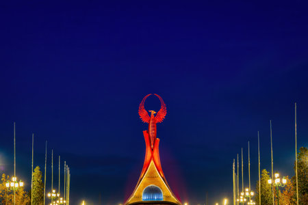 UZBEKISTAN, TASHKENT - JANUARY 4, 2023: Illuminated monument of independence in the form of a stele with a Humo bird in the New Uzbekistan park at nighttime.のeditorial素材