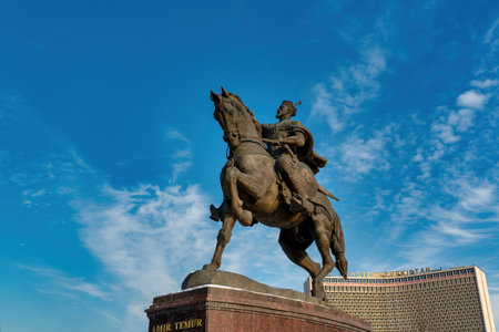 TASHKENT, UZBEKISTAN - DECEMBER 12, 2022: Monument Amir Timur or Tamerlane on a sunset against the...