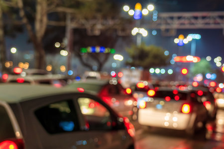 Blurred car traffic lights at night city. Traffic jam in evening rush hour.