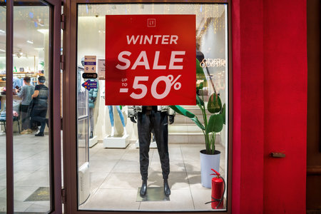 UZBEKISTAN, TASHKENT - 20 DECEMBER 2023: Exterior of clothing store with men's clothing on mannequin...
