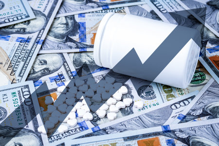 Heart-shaped pills on the background of hundred-dollar bills. The concept of the expensive cost of...