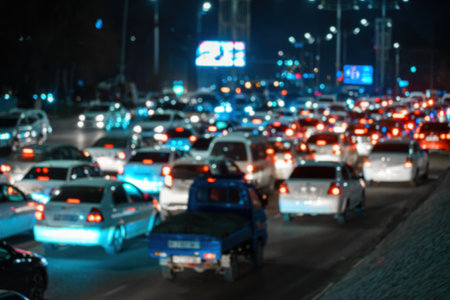 Blurred car traffic lights at night city. Traffic jam in the evening rush hour.の写真素材