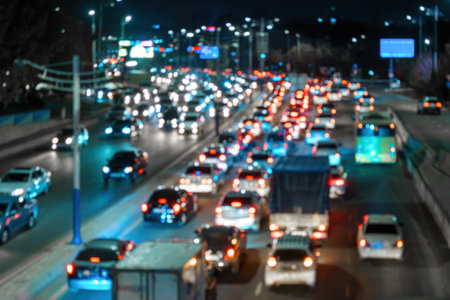 Blurred car traffic lights at night city. Traffic jam in the evening rush hour.の写真素材