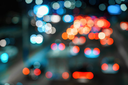 Blurred car traffic lights at night city. Traffic jam in the evening rush hour.の写真素材