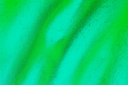 A fragment of colorful graffiti painted on a wall. Abstract urban background for design. spray painting art.の写真素材