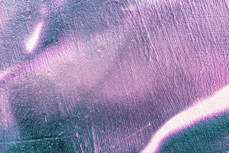 A fragment of colorful graffiti painted on a wall. Abstract urban background for design. spray painting art.の写真素材