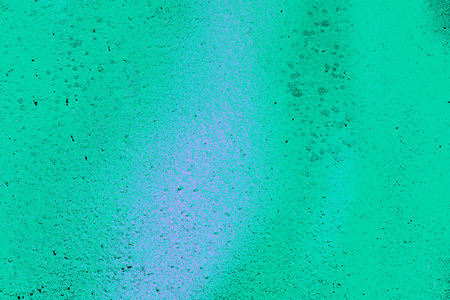 A fragment of colorful graffiti painted on a wall. Abstract urban background for design. spray painting art.の写真素材