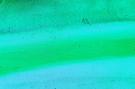 A fragment of colorful graffiti painted on a wall. Abstract urban background for design. spray painting art.の写真素材