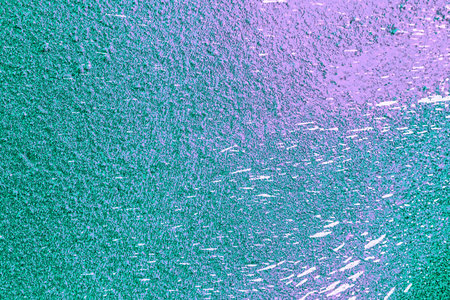 A fragment of colorful graffiti painted on a wall. Abstract urban background for design. spray painting art.の写真素材