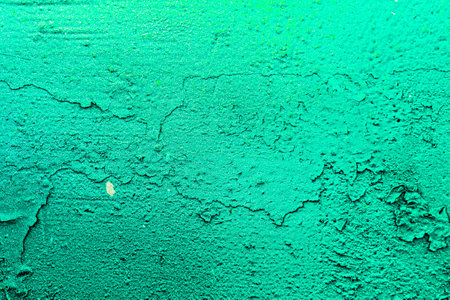 A fragment of colorful graffiti painted on a wall. Abstract urban background for design. spray painting art.の写真素材