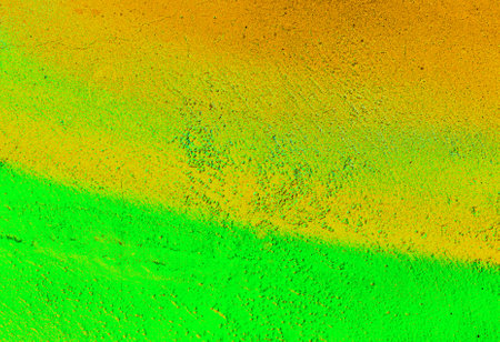 A fragment of colorful graffiti painted on a wall. Abstract urban background for design. spray painting art.の写真素材