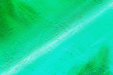 A fragment of colorful graffiti painted on a wall. Abstract urban background for design. spray painting art.の写真素材