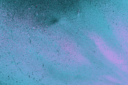 A fragment of colorful graffiti painted on a wall. Abstract urban background for design. spray painting art.の写真素材