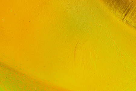 A fragment of colorful graffiti painted on a wall. Abstract urban background for design. spray painting art.の写真素材