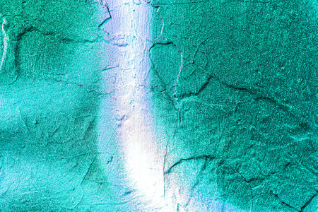 A fragment of colorful graffiti painted on a wall. Abstract urban background for design. spray painting art.の写真素材