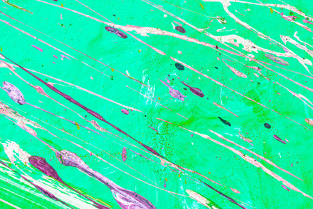 A fragment of colorful graffiti painted on a wall. Abstract urban background for design. spray painting art.の写真素材