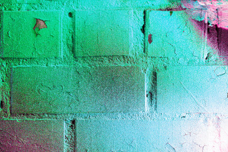 A fragment of colorful graffiti painted on a wall. Abstract urban background for design. spray painting art.の写真素材