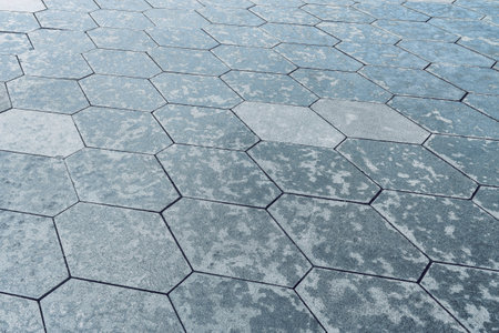 The texture of a monotonous hexagonal tiled pavement with perspective.の写真素材