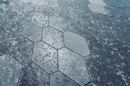 The texture of a monotonous hexagonal tiled pavement with perspective.の写真素材