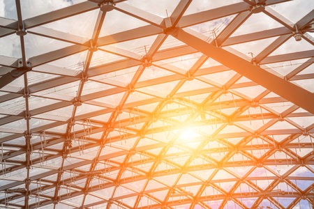 Glass metal framed roof of a modern building. abstract architectural background.の写真素材