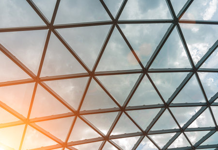 Glass metal framed roof of a modern building. abstract architectural background.の写真素材