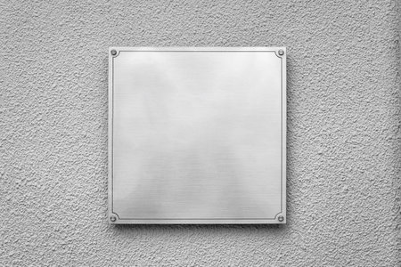 Steel square board with copyspace for text hanging on the wall. Mockup for design. abstract background.の写真素材