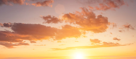 The rays of the sun breaking through the dramatic clouds in the evening or in the morning in the sunset or dawn sky. The concept of faith, hope for the best or good weather.の写真素材