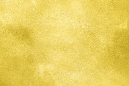 Texture of golden decorative plaster or concrete. Abstract gold grunge background for design.の写真素材
