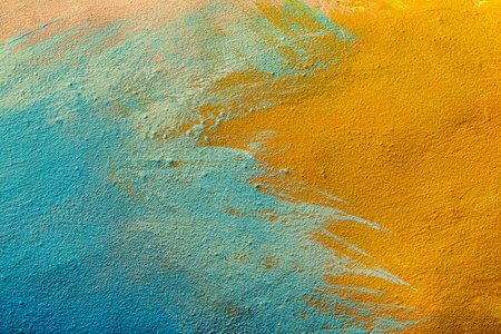 A fragment of colorful graffiti painted on a wall. Abstract urban background for design. spray...