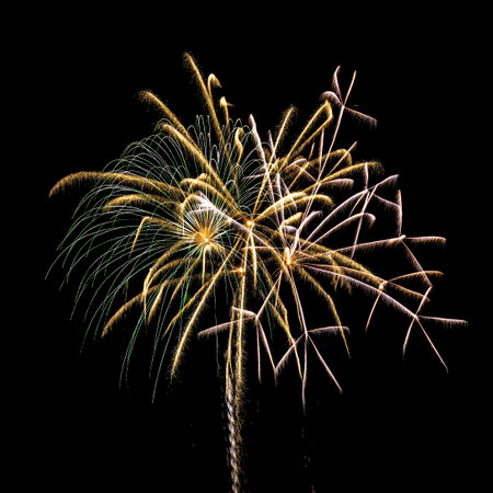 Colorful celebration fireworks isolated on a night black sky background.の写真素材
