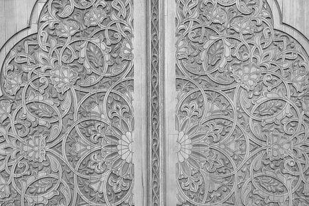Black and white Carved antique wooden doors with patterns and mosaics.の写真素材