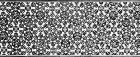 Geometric traditional Islamic ornament. Fragment of a ceramic mosaic.Abstract background. black and...