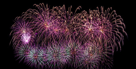 Colorful celebration fireworks isolated on a night black sky background.の写真素材