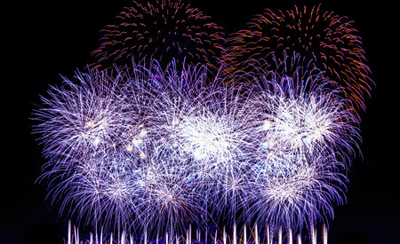 Colorful celebration fireworks isolated on a night black sky background.の写真素材