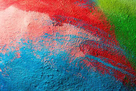 A fragment of colorful graffiti painted on a wall. Abstract urban background for design. Spray painting art.の写真素材