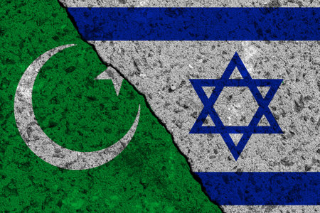 The crack between the Islam and Israel flags on the concrete wall. The concept of sanctions, war, the deterioration of diplomatic relations, confrontation and severance of agreements.の写真素材