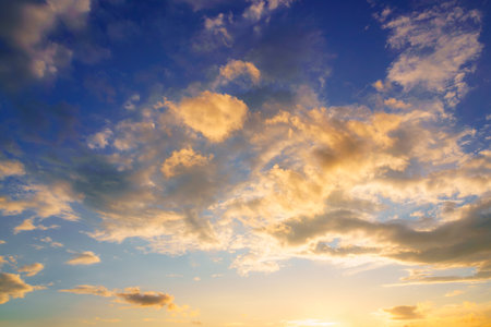 Dramatic cloudy sky at sunset or sunrise. Nature background.の写真素材
