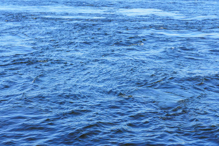 The texture of ripples on the water. Abstract natural background.