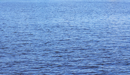The texture of ripples on the water. Abstract natural background.