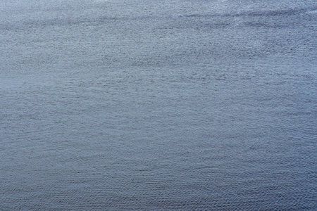 The texture of ripples on the water. Abstract natural background.