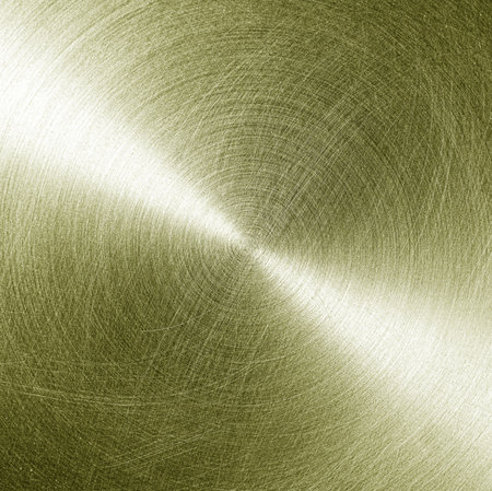 Golden circular brushed shiny metal texture. Abstract metallic background for design. Circle shape.の写真素材