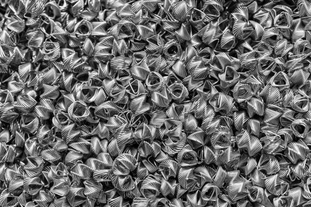 Background of steel wires twisted into spirals in the form of prisms. Spiral-prismatic nozzle....